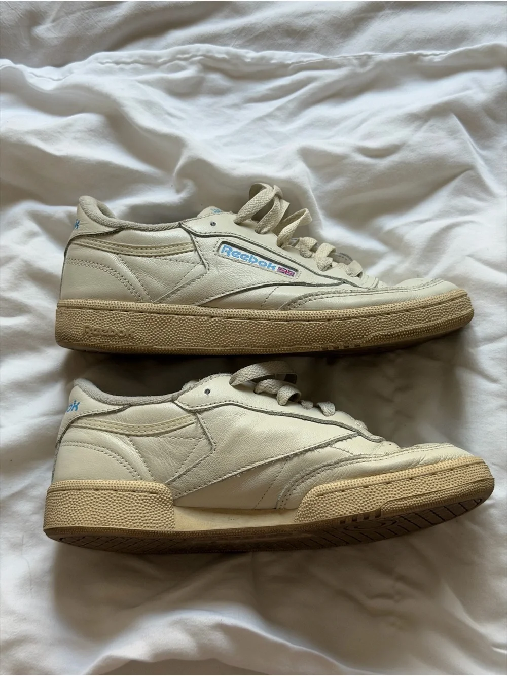 Reebok Kids Classic Leather Sneaker in Off-White with Blue and Red Accents